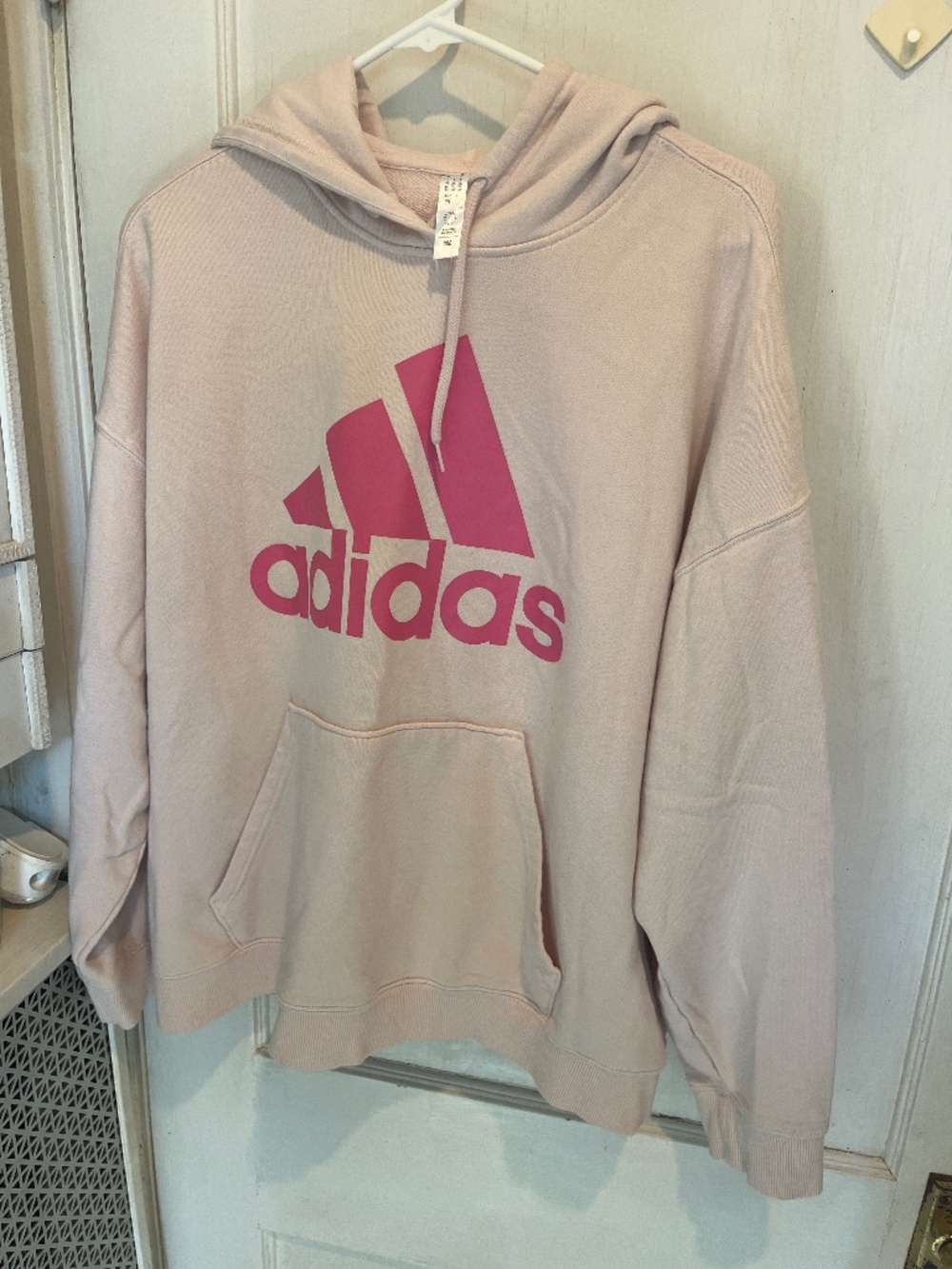 light pink Adidas Essentials fleece hoodie